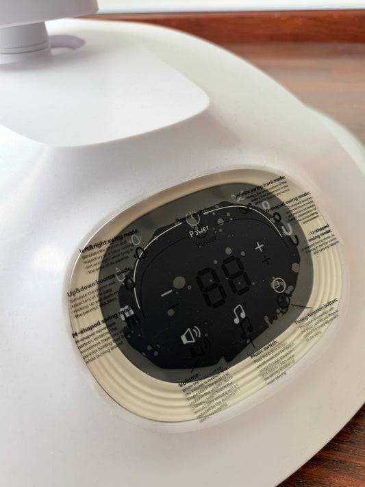 Columpio eléctrico para bebés Momcozy